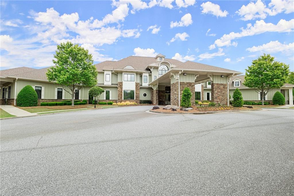 3476 Locust Cove Road Gainesville, GA 30504 - Photo 34 of 71 a front view of a house with a garden