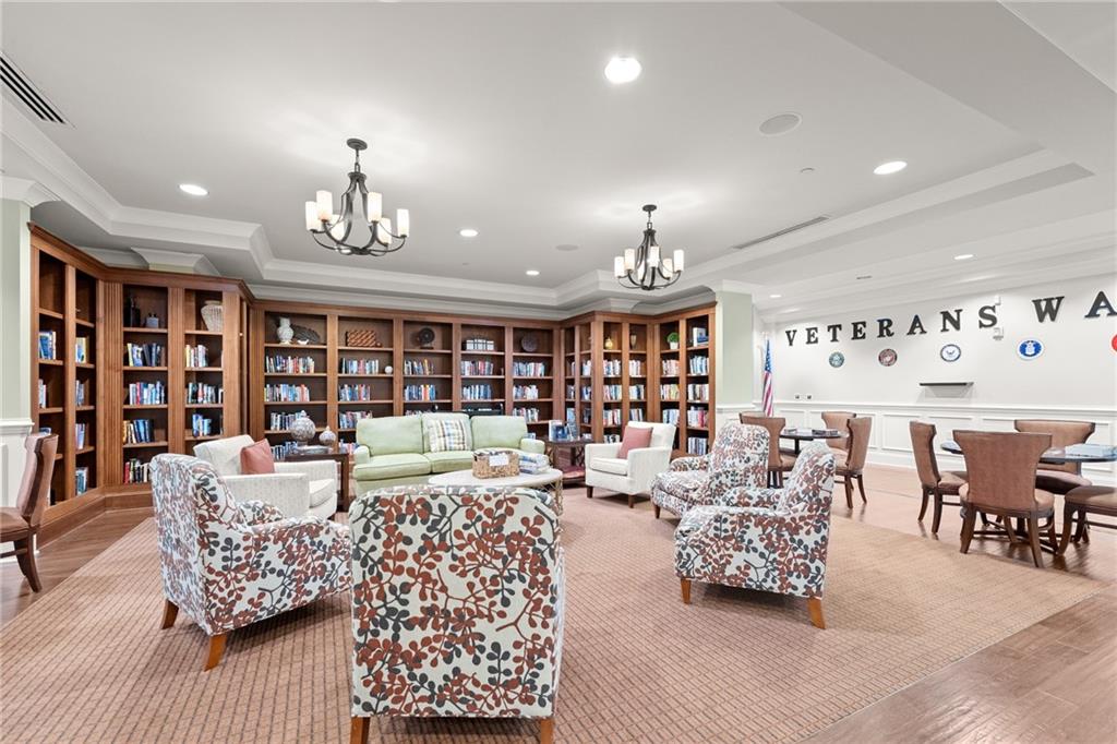 3476 Locust Cove Road Gainesville, GA 30504 - Photo 45 of 71 a living room with furniture kitchen view and a chandelier