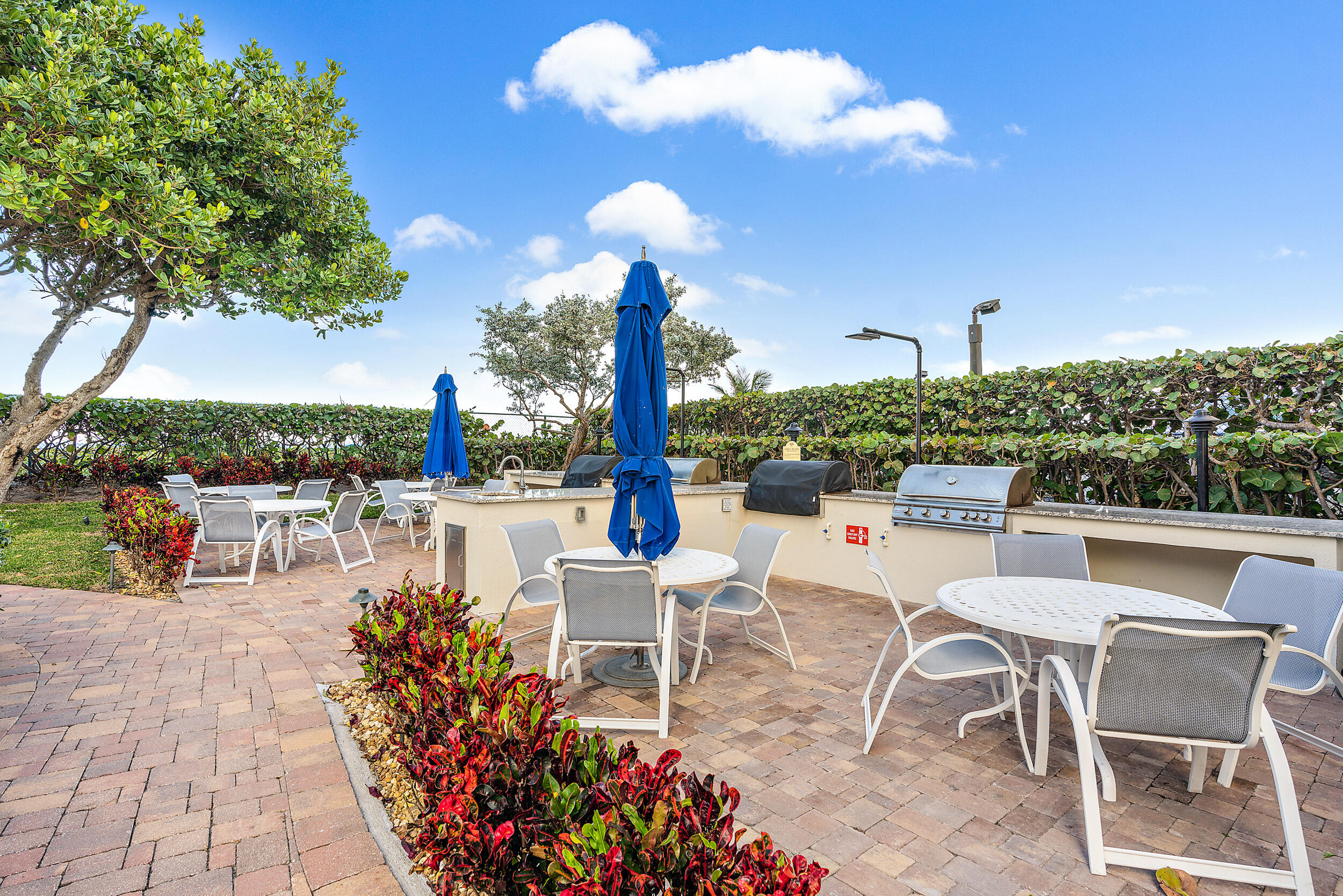 3000 North Ocean Drive, Unit 17D Riviera Beach, FL 33404 - Photo 16 of 34 a view of a patio with dining table and chairs