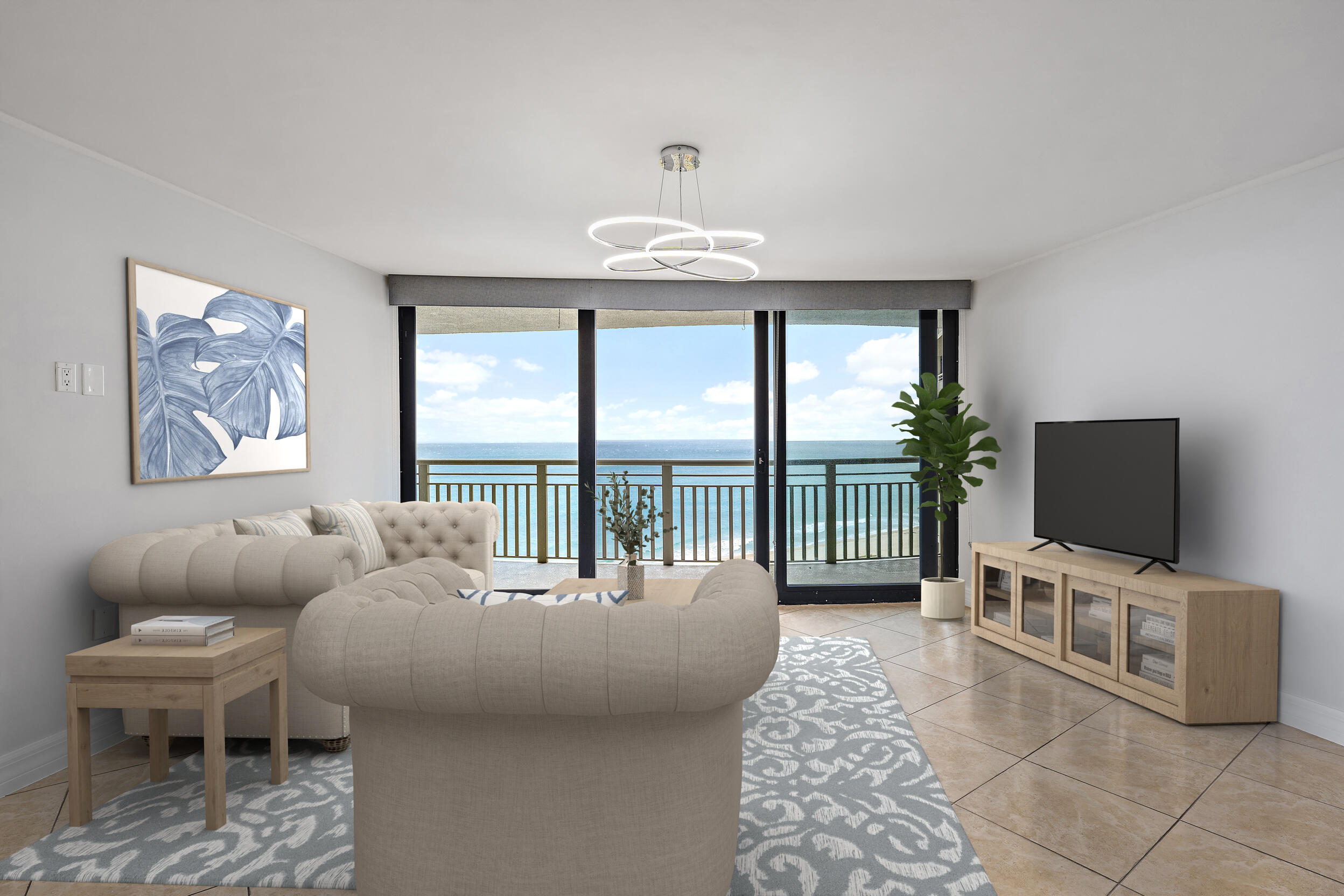 3000 North Ocean Drive, Unit 17D Riviera Beach, FL 33404 - Photo 2 of 34 a living room with furniture a flat screen tv and a floor to ceiling window