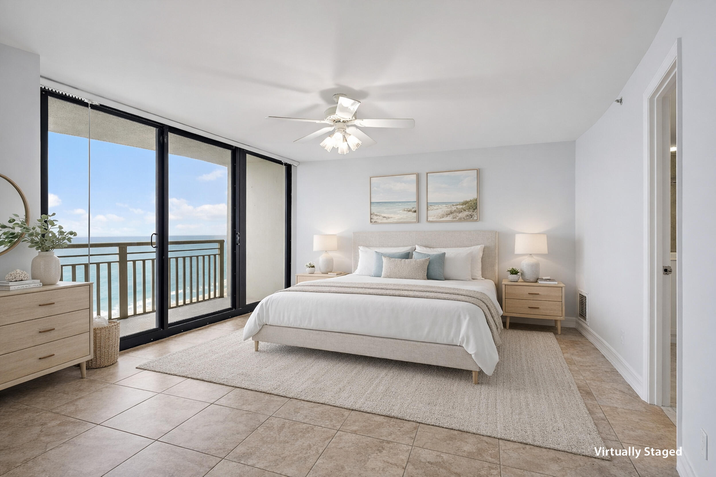 3000 North Ocean Drive, Unit 17D Riviera Beach, FL 33404 - Photo 10 of 34 a bedroom with a large bed and a chandelier fan