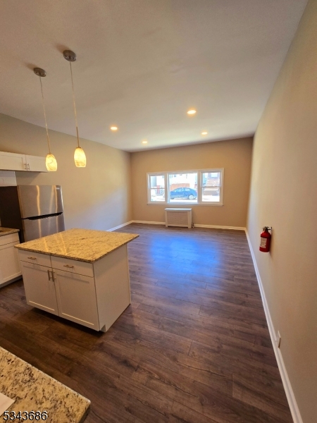 308 North 2nd Street Harrison, NJ 07029 - Photo 5 of 10 a living room with hard wood floors and a wooden floor