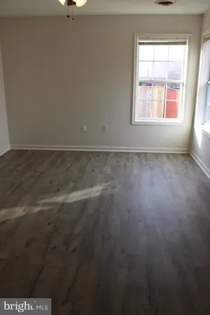 a view of a deck with couches and wooden floor