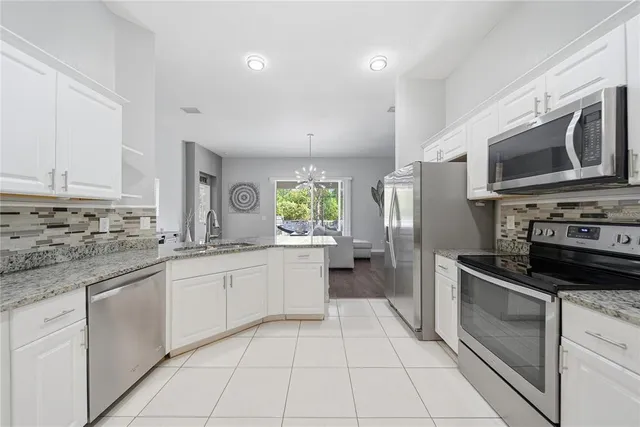 a kitchen with a sink stove and refrigerator