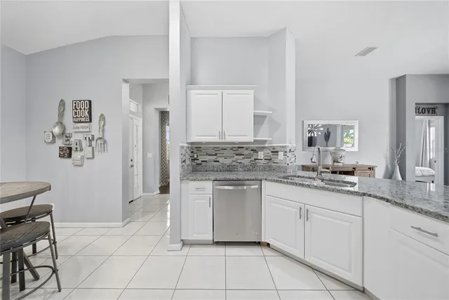 a kitchen with a sink and cabinets