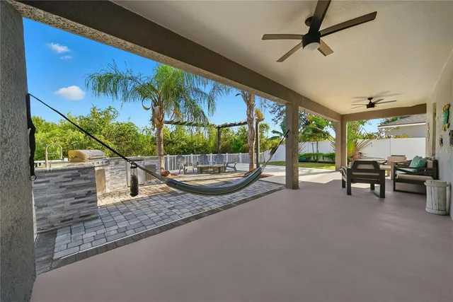 a room with furniture and a potted plant