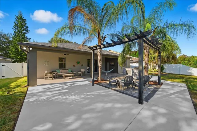 a view of a chair and tables in the patio