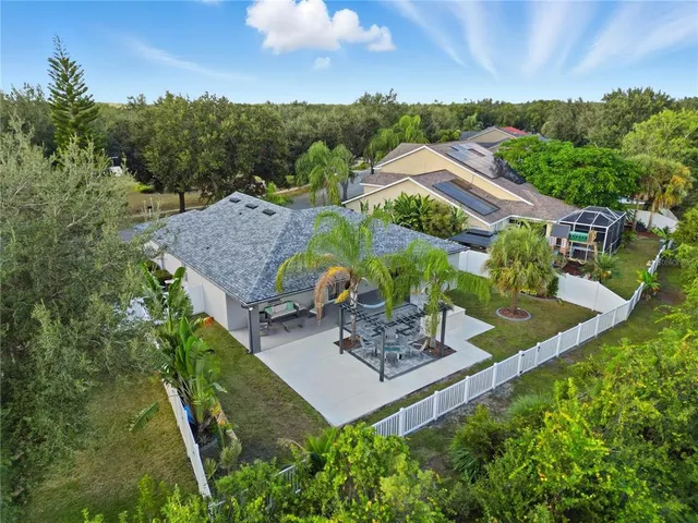 a aerial view of a house with a yard