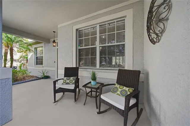 a living room with furniture and windows