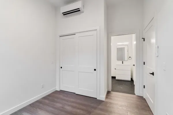 wooden floor with white walls