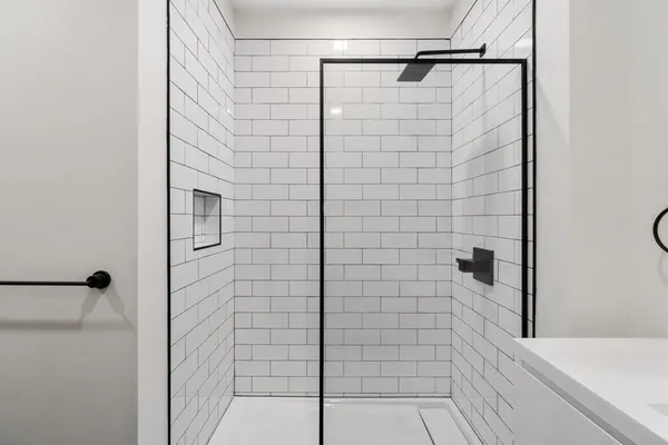 a bathroom with a shower and a shower