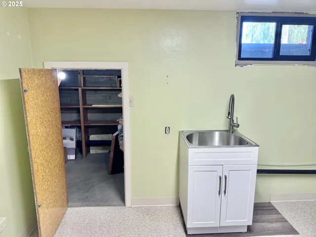 a kitchen with a refrigerator and cabinets