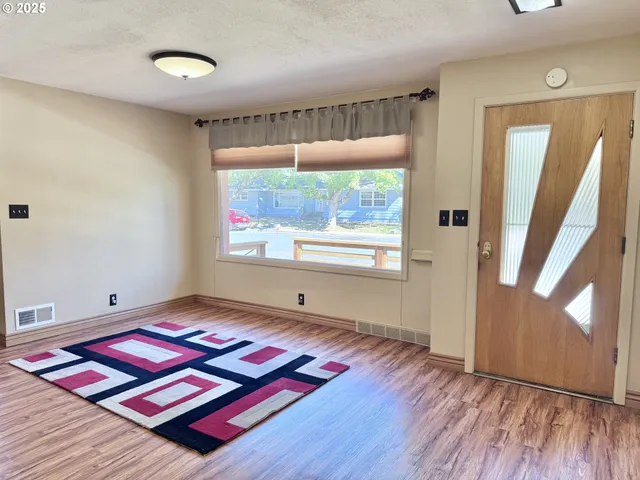 a bedroom with furniture and a window