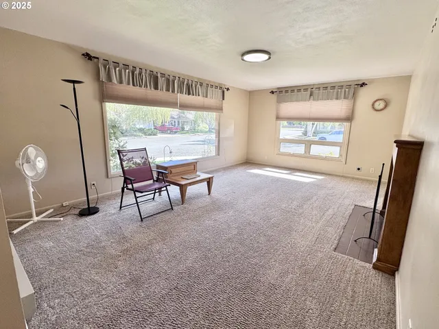 a view of a livingroom with furniture window and outside view