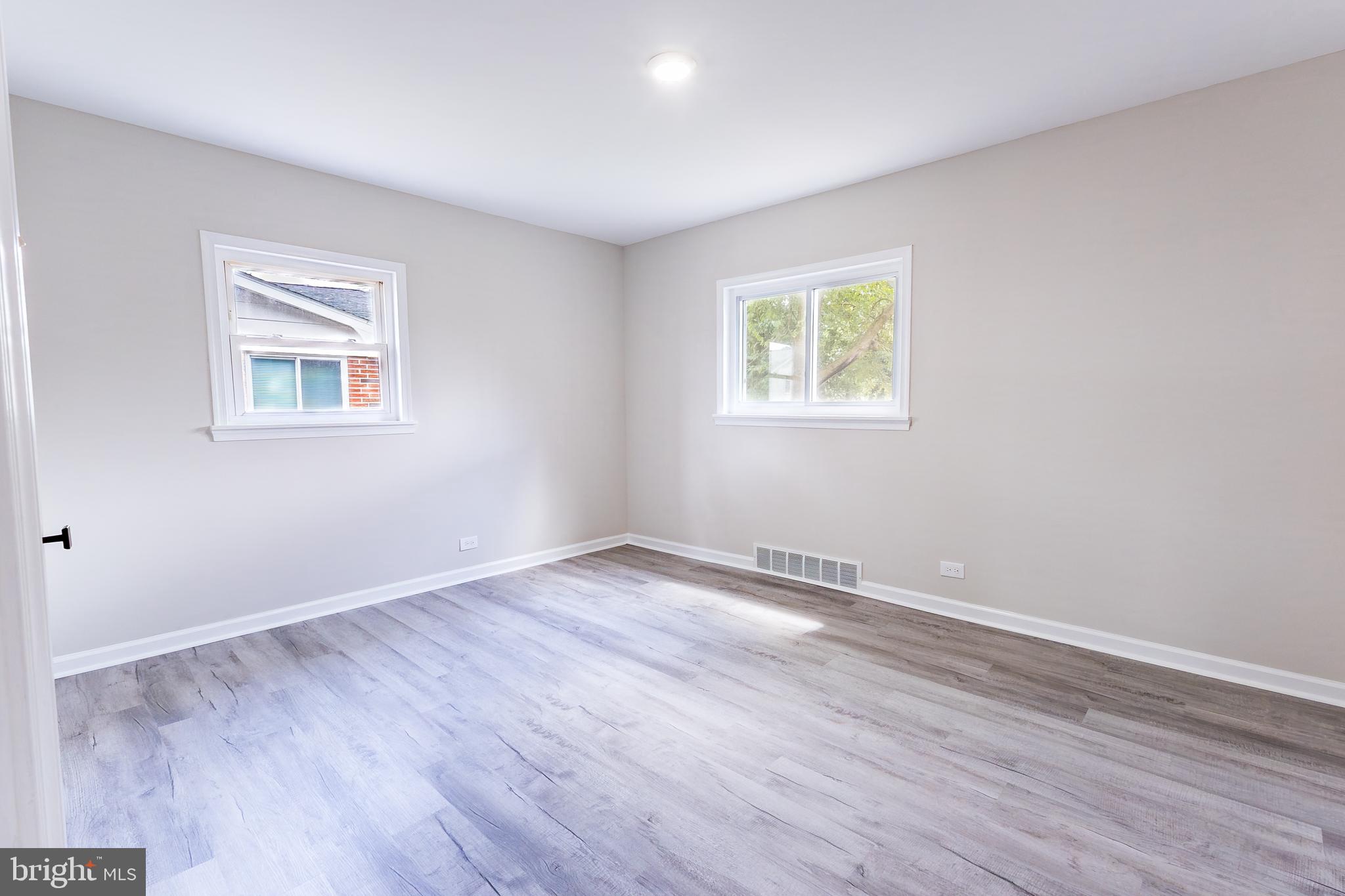 1714 Elliott Avenue Bethlehem, PA 18018 - Photo 14 of 39 a view of an empty room with wooden floor and a window