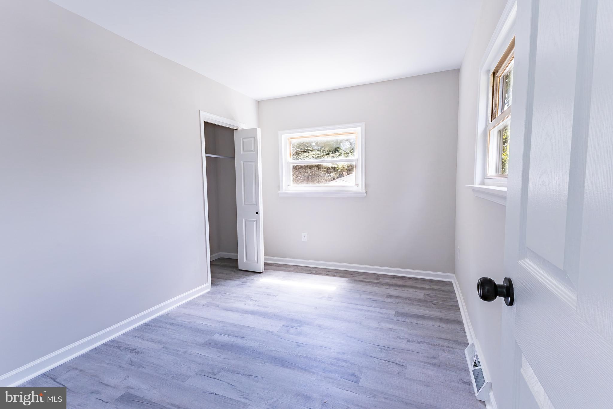1714 Elliott Avenue Bethlehem, PA 18018 - Photo 21 of 39 an empty room with wooden floor and windows