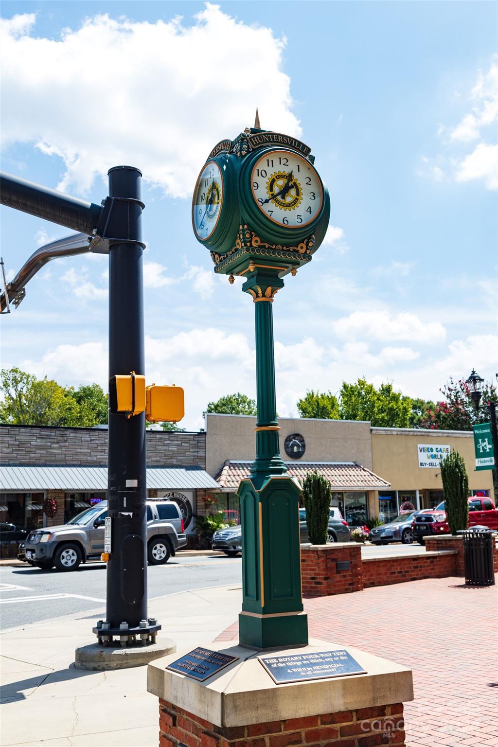 9531 Pointer Road, Unit 74 Huntersville, NC 28078 - Photo 13 of 16 a view of a street with a fountain and a table
