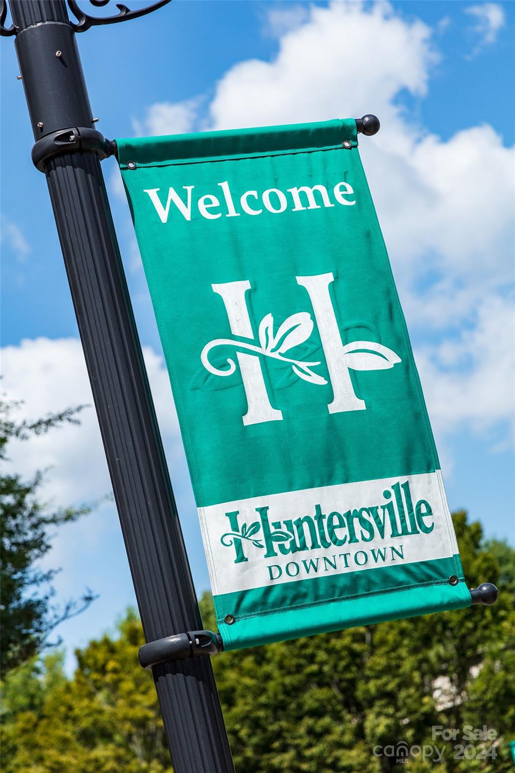 9531 Pointer Road, Unit 74 Huntersville, NC 28078 - Photo 14 of 16 a sign on the side of a building