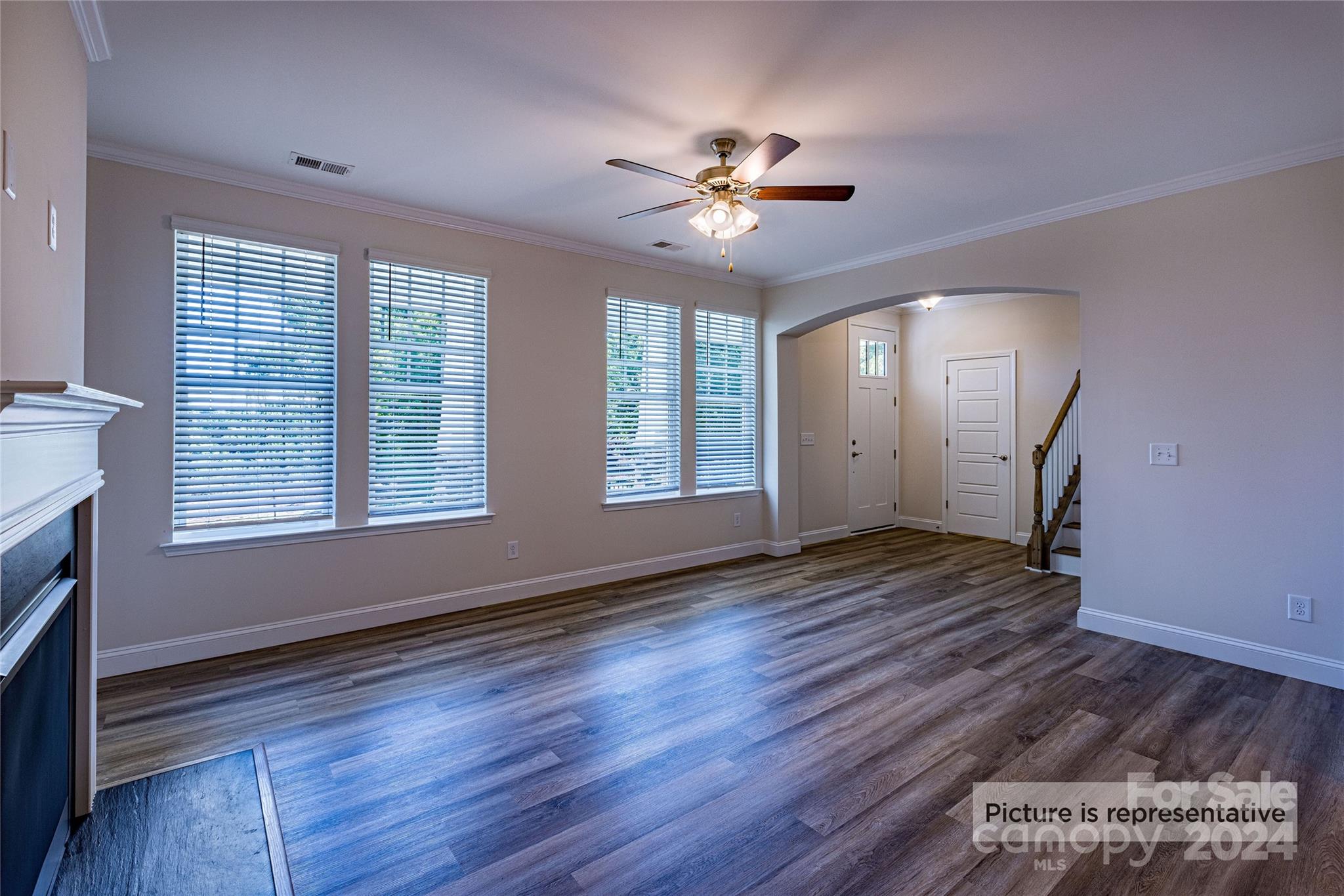 9531 Pointer Road, Unit 74 Huntersville, NC 28078 - Photo 3 of 16 a view of an empty room with wooden floor and a window