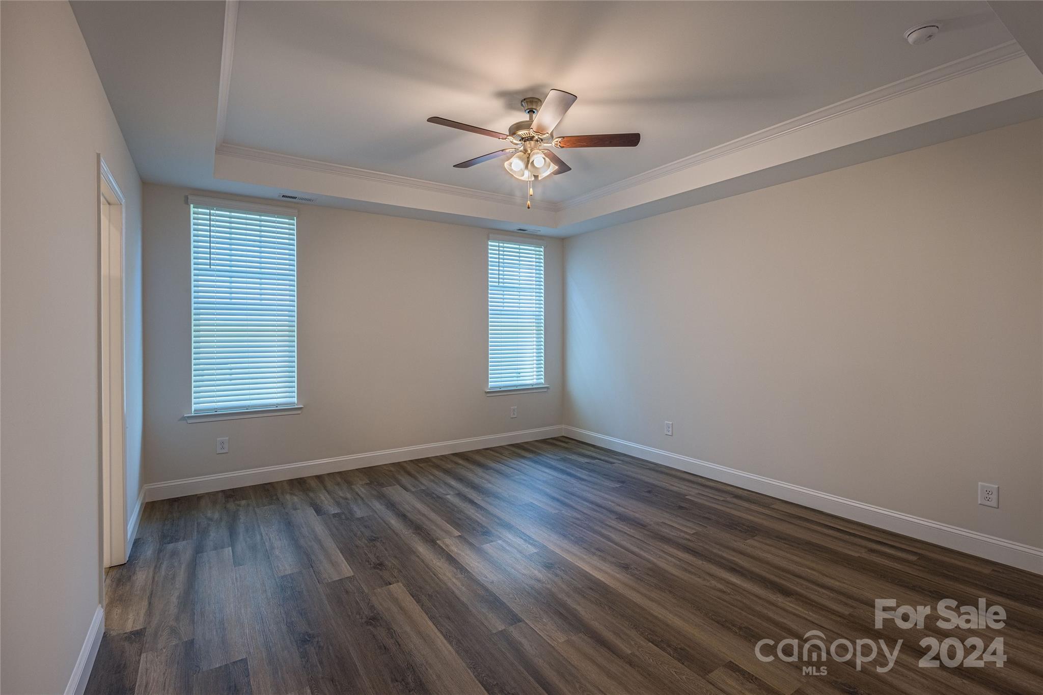 9531 Pointer Road, Unit 74 Huntersville, NC 28078 - Photo 7 of 16 wooden floor in an empty room with a window