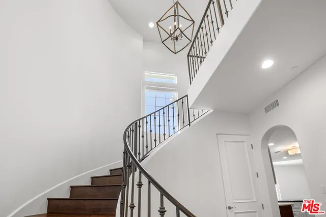 a view of a hallway with a white door
