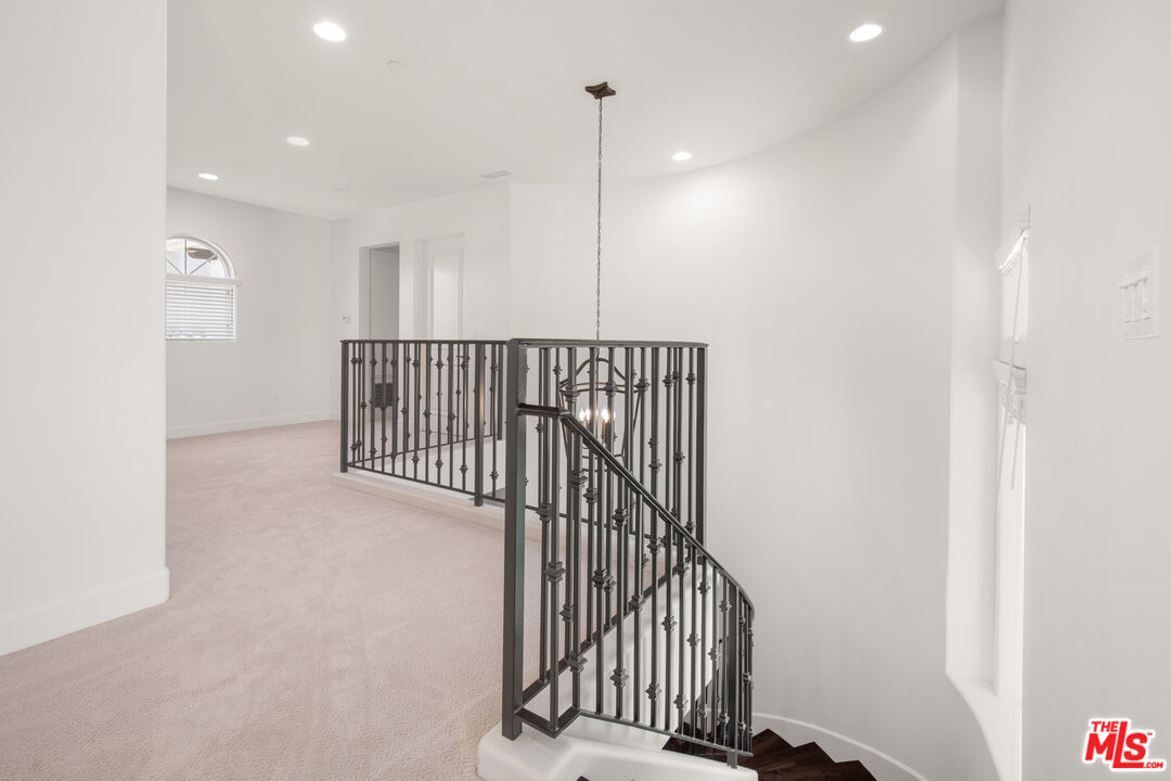 18326 Columbus Circle Tarzana, CA 91356 - Photo 14 of 34 a view of a hallway with a white door