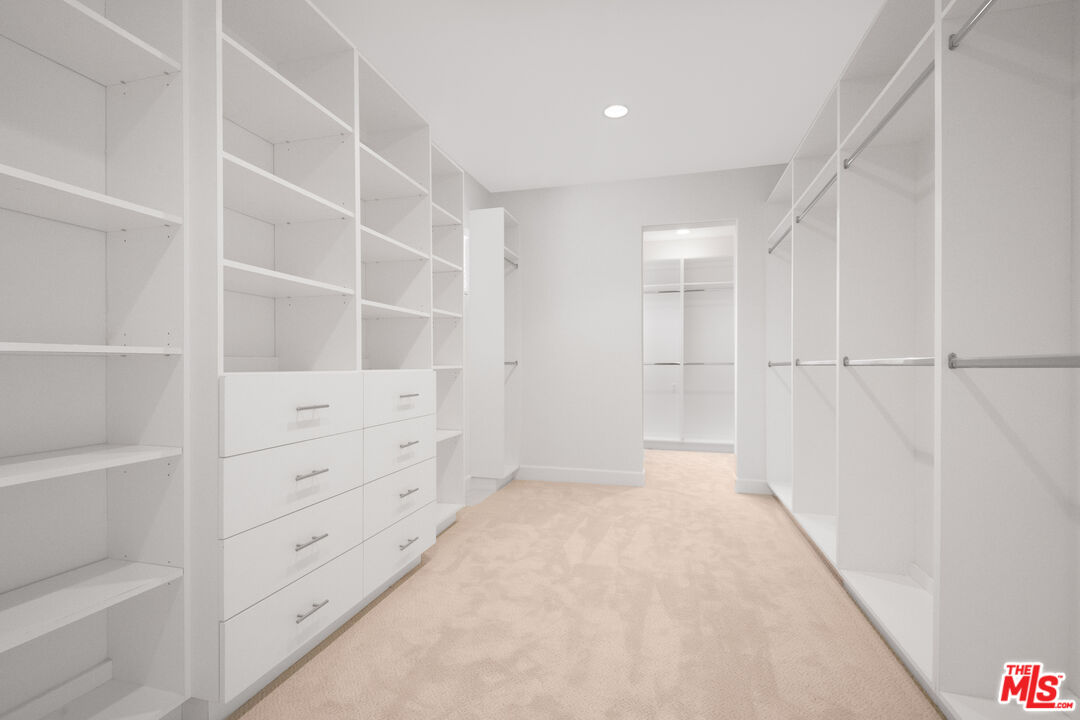 18326 Columbus Circle Tarzana, CA 91356 - Photo 18 of 34 a view of an empty walk in closet