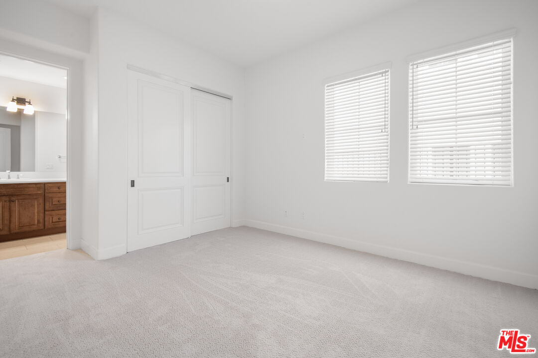 18326 Columbus Circle Tarzana, CA 91356 - Photo 28 of 34 an empty room with windows