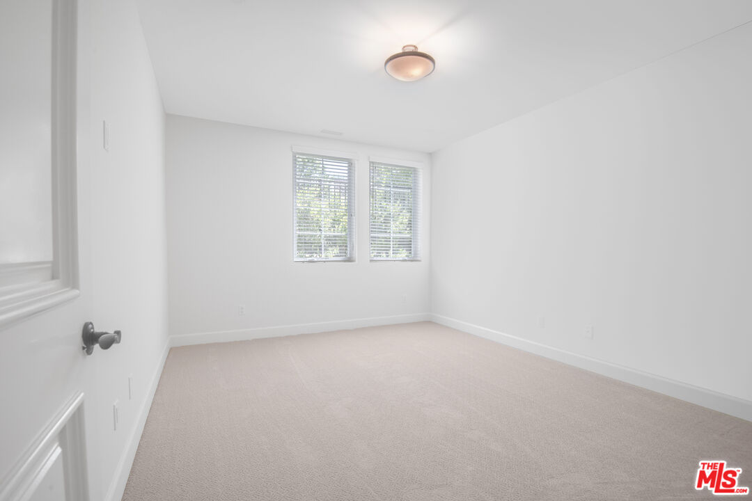 18326 Columbus Circle Tarzana, CA 91356 - Photo 30 of 34 an empty room with windows