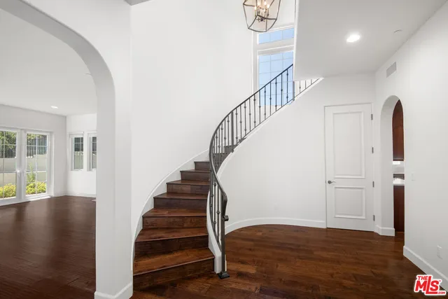 a view of entryway with wooden floor