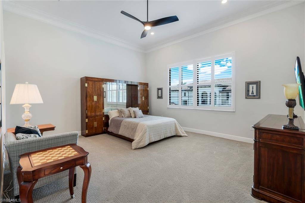 2488 Breakwater Way, Unit 201 Naples, FL 34112 - Photo 19 of 48 a bedroom with furniture and a window