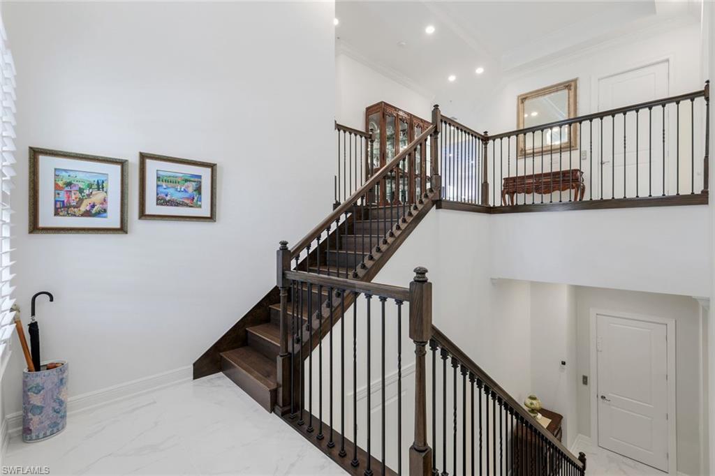 2488 Breakwater Way, Unit 201 Naples, FL 34112 - Photo 24 of 48 a view of entryway with stairs and furniture