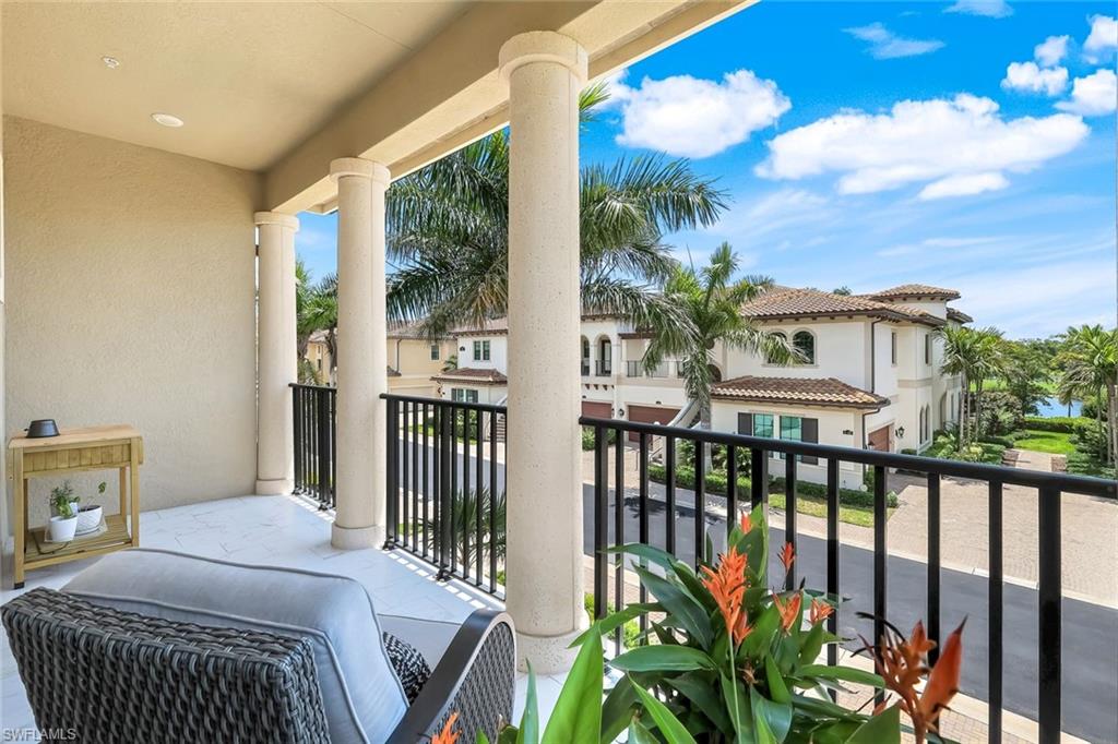 2488 Breakwater Way, Unit 201 Naples, FL 34112 - Photo 28 of 48 a bedroom with furniture a potted plant and wooden fence