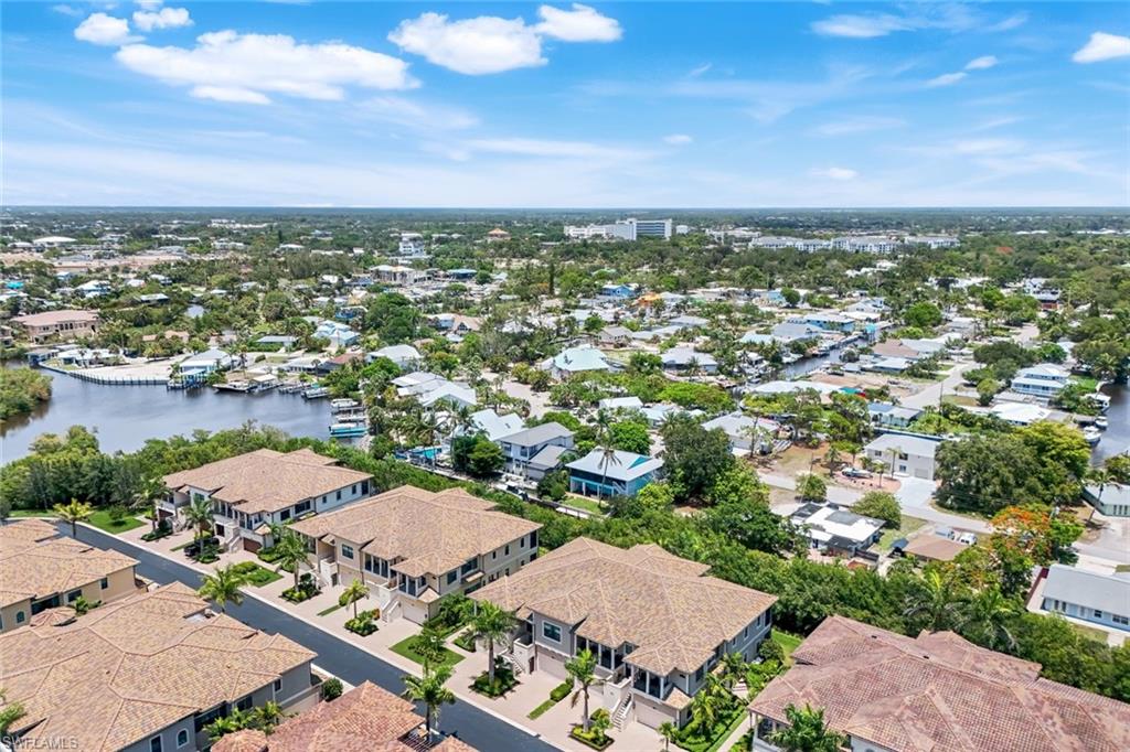 2488 Breakwater Way, Unit 201 Naples, FL 34112 - Photo 34 of 48 an aerial view of a city with lots of residential buildings