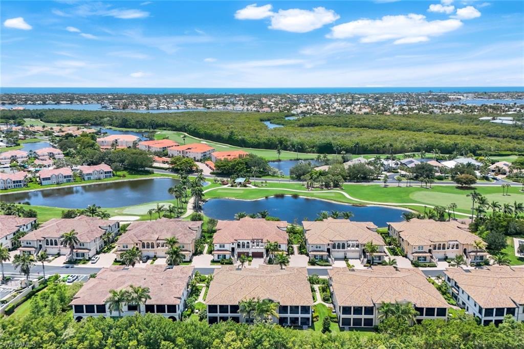 2488 Breakwater Way, Unit 201 Naples, FL 34112 - Photo 35 of 48 an aerial view of a city with lake view