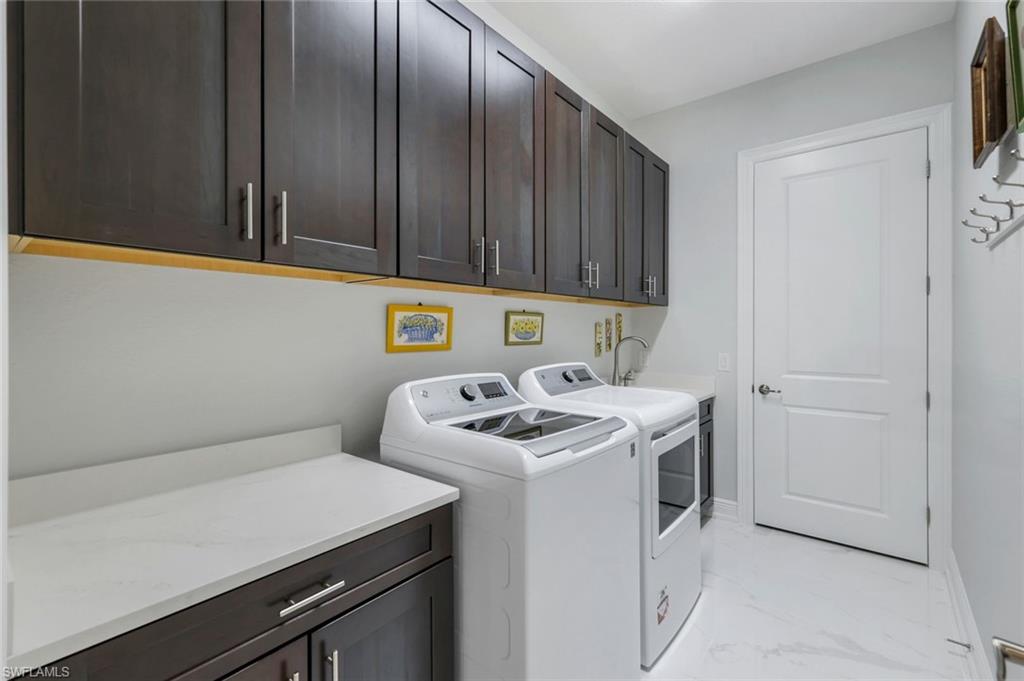 2488 Breakwater Way, Unit 201 Naples, FL 34112 - Photo 39 of 48 a utility room with dryer and washer