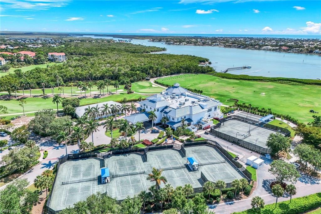 2488 Breakwater Way, Unit 201 Naples, FL 34112 - Photo 46 of 48 an aerial view of a house with a garden and mountain view
