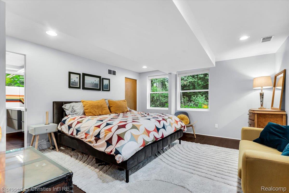 3939 Charing Cross Road Bloomfield Hills, MI 48304 - Photo 32 of 33 Recessed lighting illuminates this bright primary featuring light-toned walls and wood-finish flooring