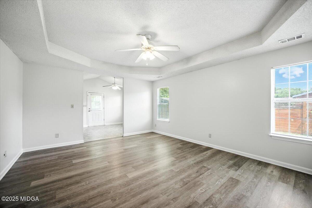 4801 Wilson Road Macon, GA 31206 - Photo 11 of 18 wooden floor in an empty room with a window