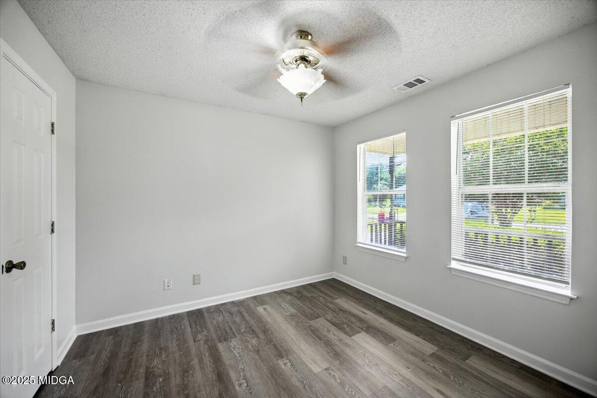 4801 Wilson Road Macon, GA 31206 - Photo 4 of 18 a view of an empty room with a window