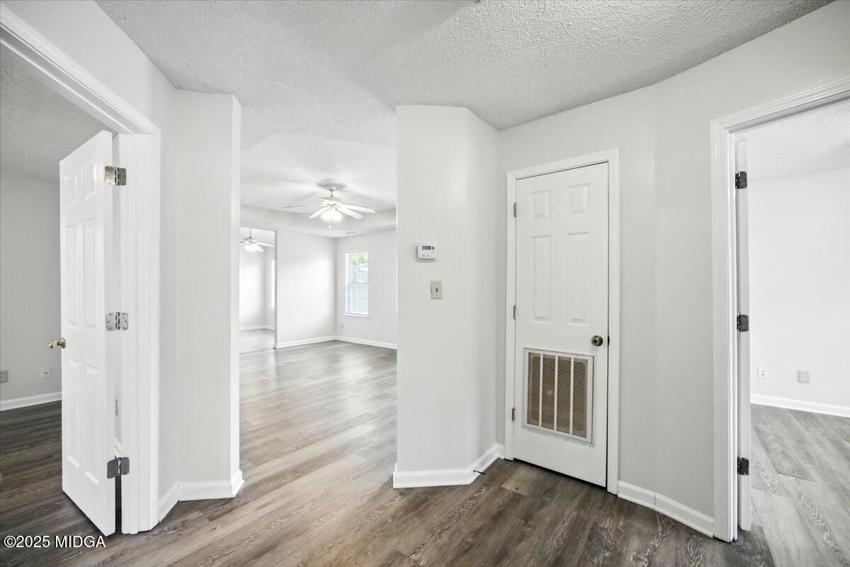 4801 Wilson Road Macon, GA 31206 - Photo 8 of 18 a view of a hallway with wooden floor