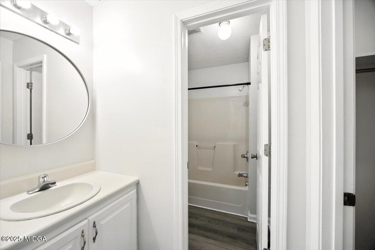4801 Wilson Road Macon, GA 31206 - Photo 10 of 18 a bathroom with a sink and a mirror