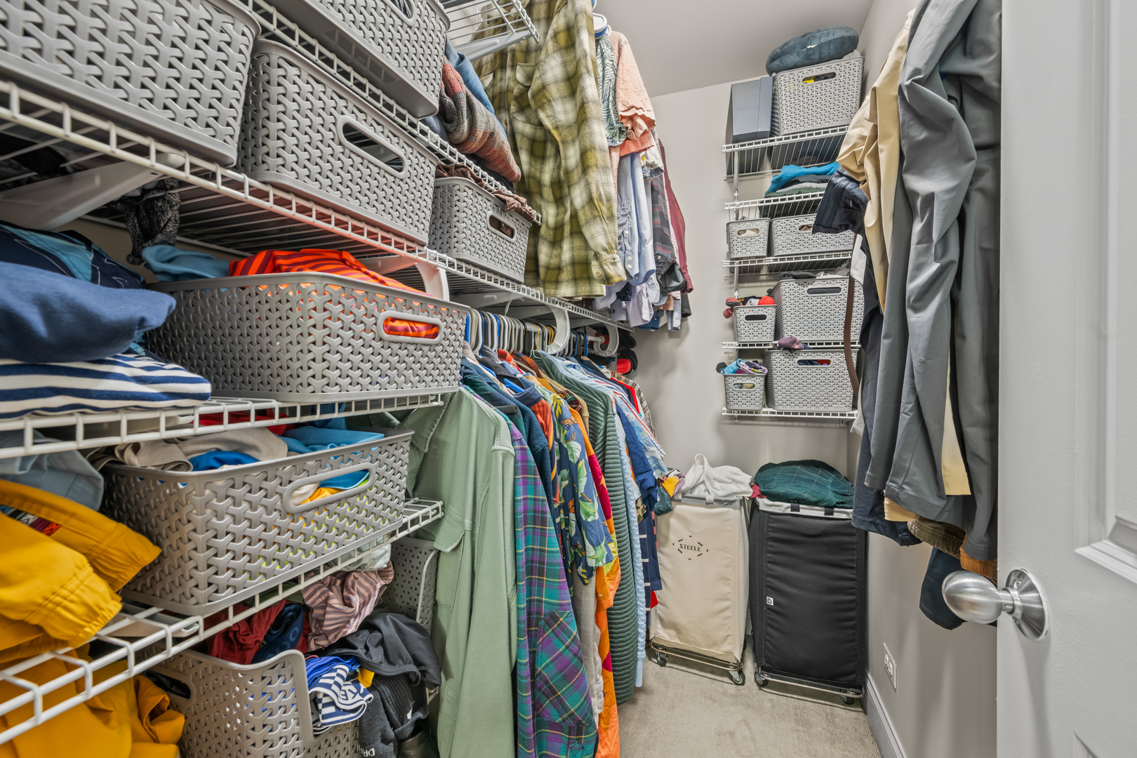1647 West Addison Street, Unit 1B Chicago, IL 60613 - Photo 16 of 23 a view of walk in closet with clothes