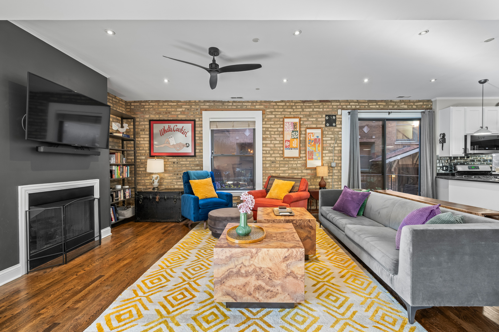 1647 West Addison Street, Unit 1B Chicago, IL 60613 - Photo 2 of 23 a living room with furniture fireplace and flat screen tv
