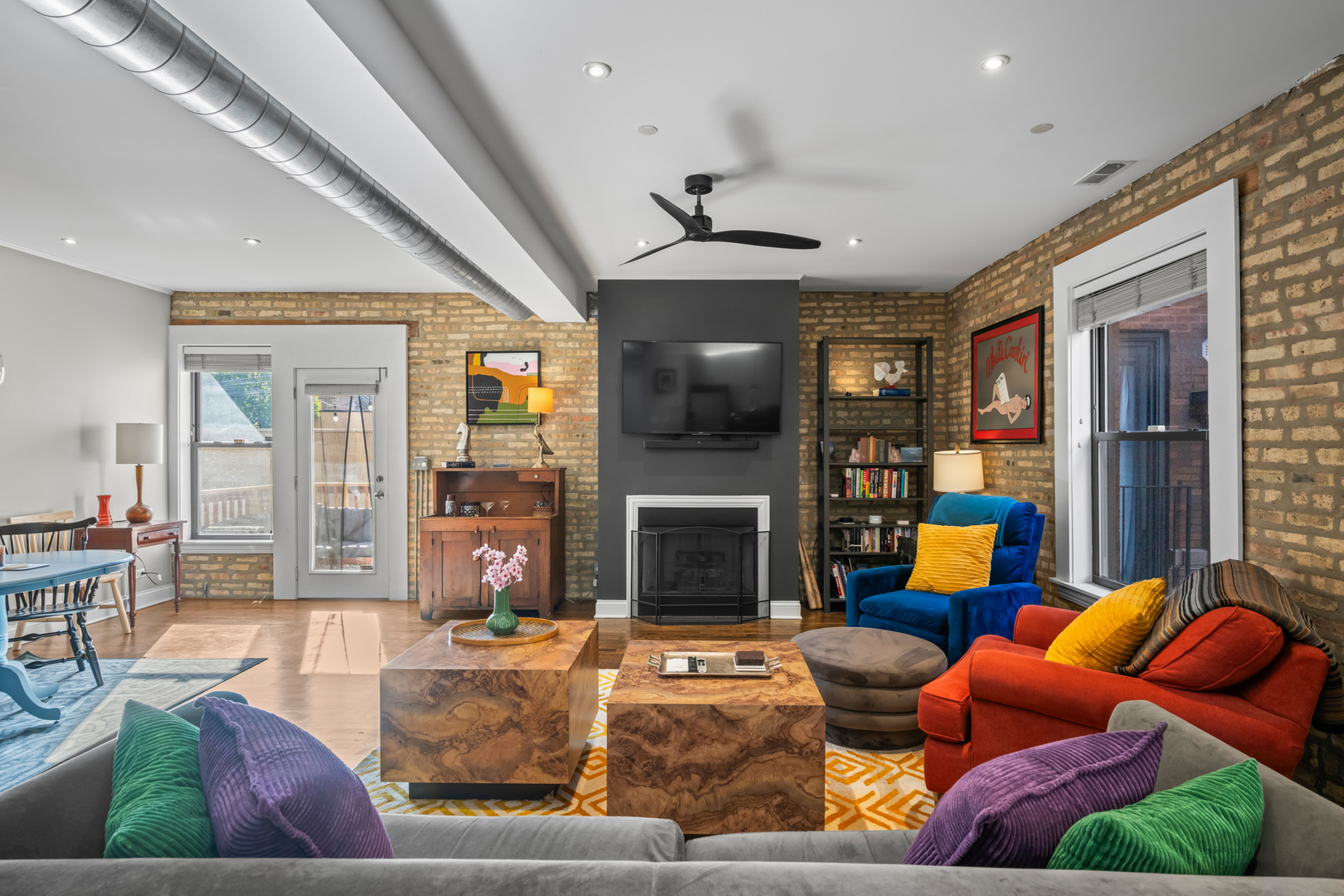 1647 West Addison Street, Unit 1B Chicago, IL 60613 - Photo 6 of 23 a living room with furniture fireplace and a large window