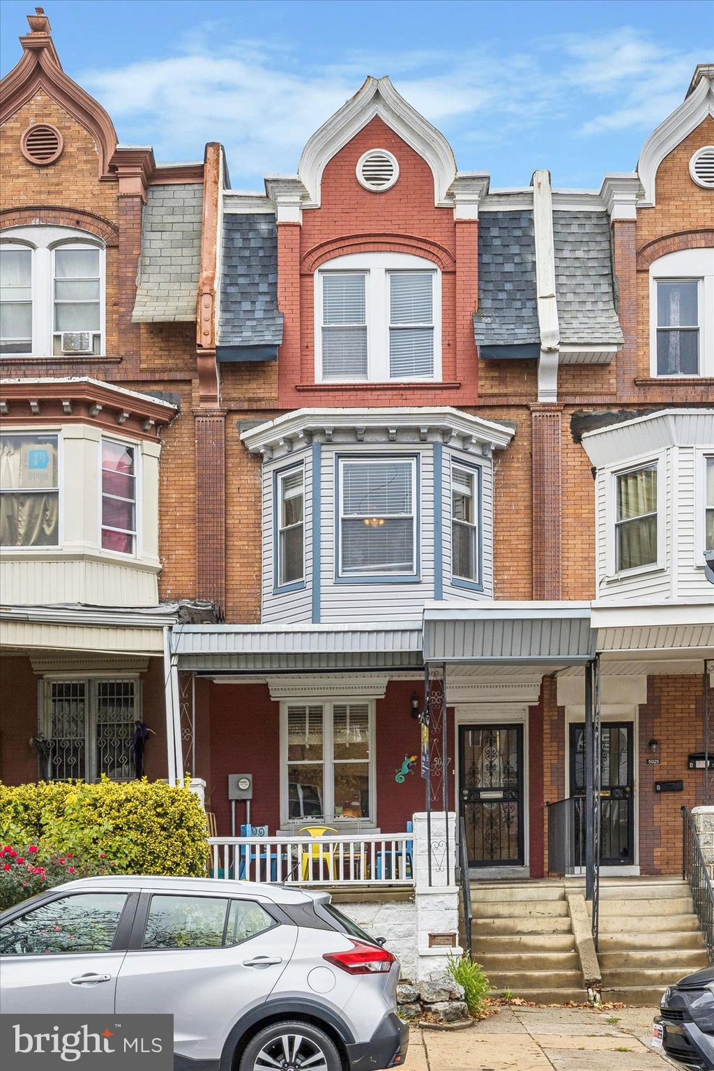 a front view of a building with a yard
