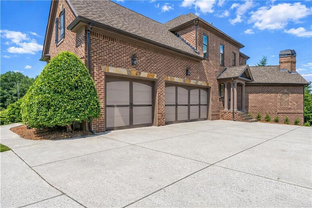2792 Springbluff Lane Buford, GA 30519 - Photo 2 of 5 a front view of a house with a garage