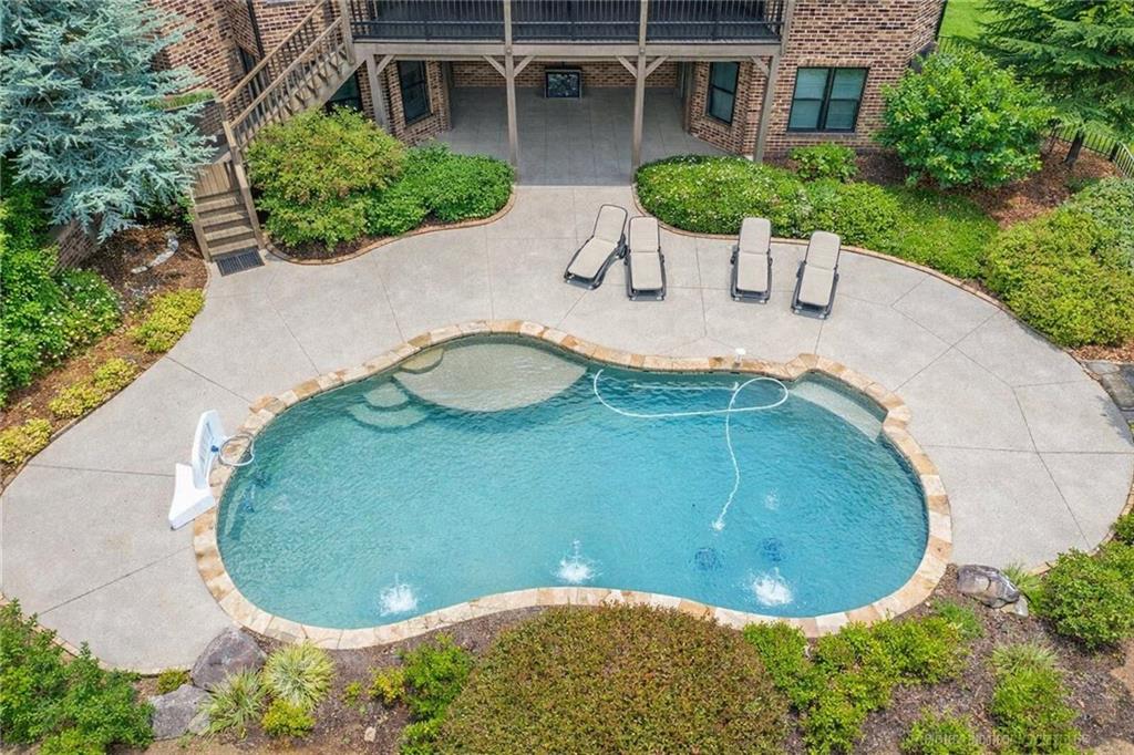 2792 Springbluff Lane Buford, GA 30519 - Photo 4 of 5 an aerial view of a house with swimming pool and garden