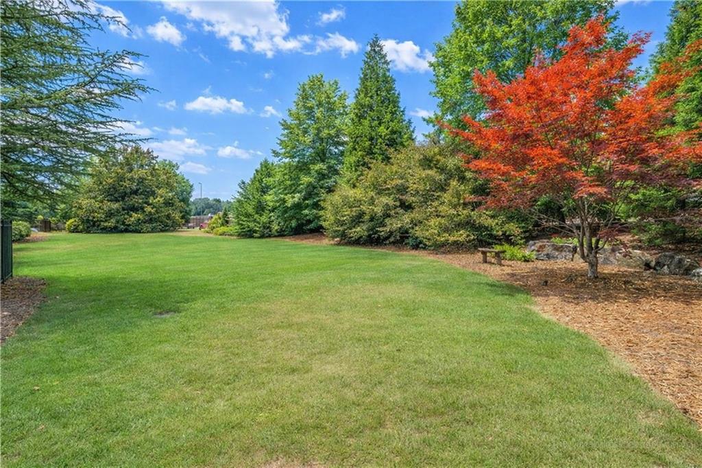 2792 Springbluff Lane Buford, GA 30519 - Photo 5 of 5 a view of a grassy field with trees