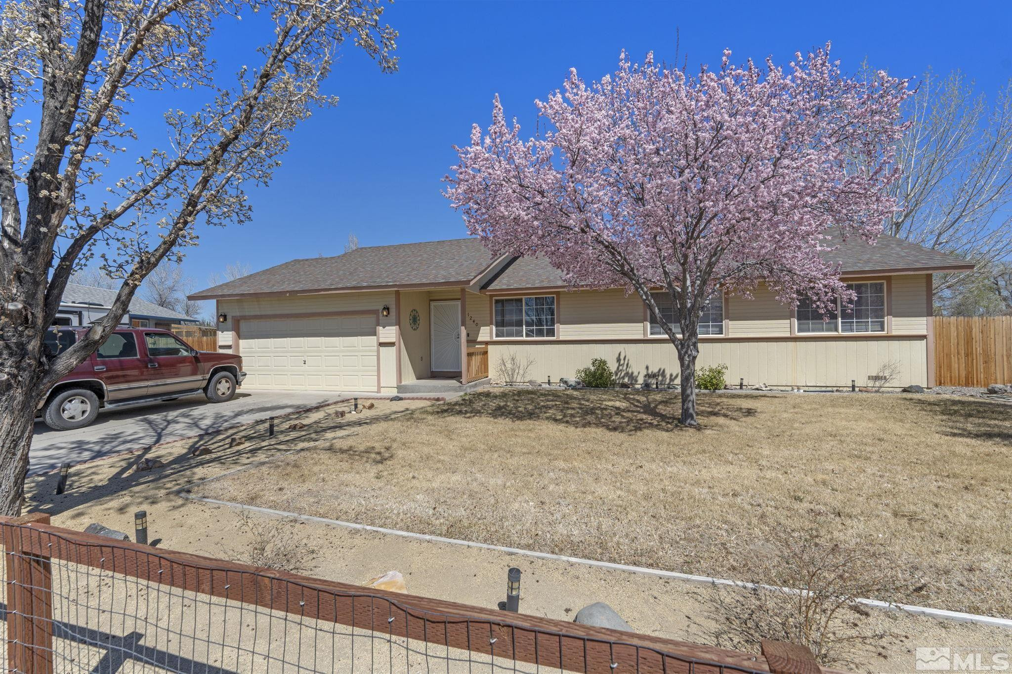 1240 Lattin Road Fallon, NV 89406 - Photo 1 of 34 a front view of a house with a yard